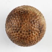 Bramble golf ball stamped "The Dunlop" - some oxidisation and crack to the opposite poll (possibly