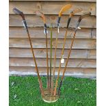Interesting brass golf club display stand - adjustable splayed arched top to hold 11 clubs mounted