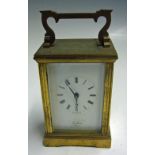 'St James London' Carriage Clock made in England brass, white with black roman numerals, with slight