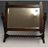 Wooden Framed Mirror with spiralled legs and base, tilting forward and back, measures 64x59cm