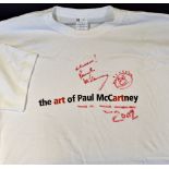 Autograph - Paul McCartney Signed T-Shirt a white T-Shirt with red inscription to the front, dated