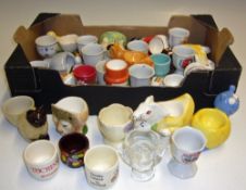 Selection of Egg Cups to include a variety of ceramic styles and shapes, with animals and cartoon