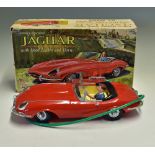 Marx Toys Battery Operated Jaguar with remote control, in red, having head lights and horn, comes