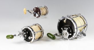 Penn Senator 12/0 and 6/0 Big Game Reels and one other (3):12/0 with rod clamp and braces, 3x