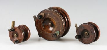 Collection of wooden and brass Nottingham reels (3): 2" dia with unusual "Y" brass back (G); 4"