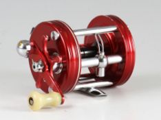 Abu Ambassadeur 6000 level wind bait casting reel: fitted with red end plates - some slight rim wear