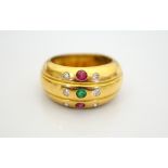 DIAMOND, RUBY AND EMERALD DRESS RING in eighteen carat gold, ring size L and approximately 6.