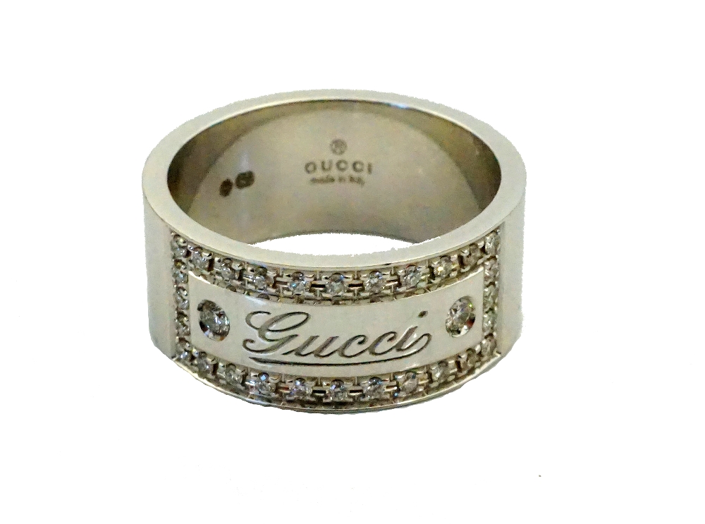 GUCCI EIGHTEEN CARAT WHITE GOLD AND DIAMOND RING the Gucci engraved panel in diamond surround, - Image 2 of 2