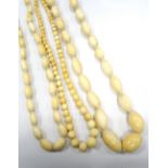 THREE 1930s CARVED IVORY GRADUATED BEAD NECKLACES bead sizes vary,