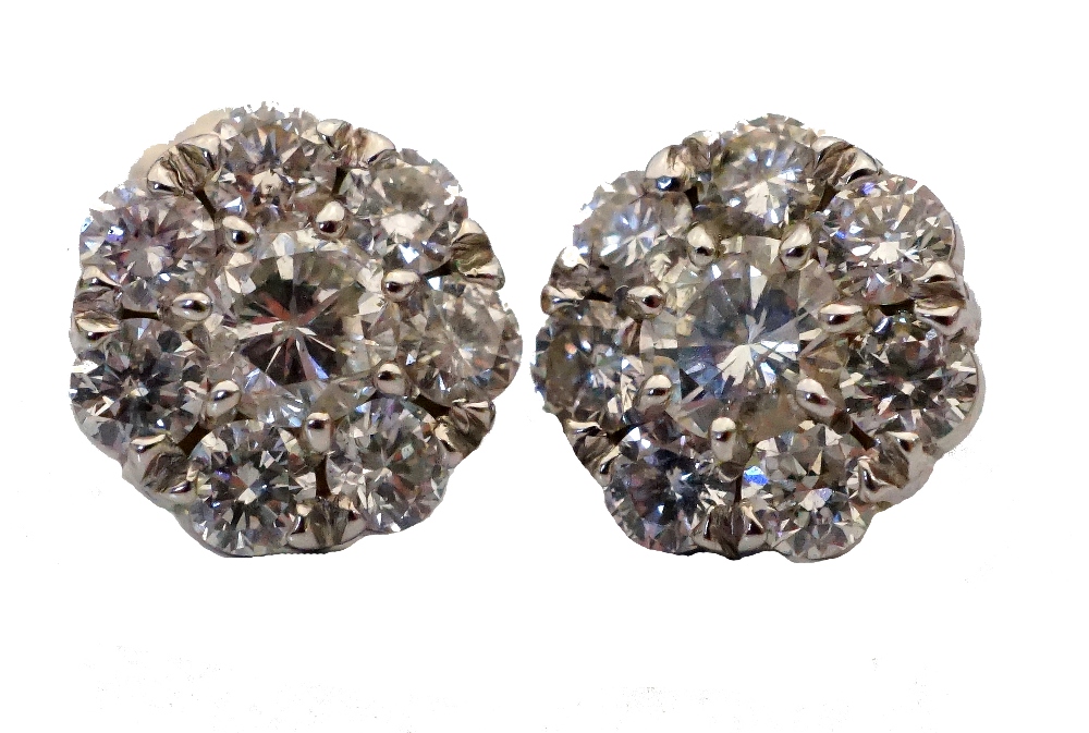 PAIR OF DIAMOND CLUSTER STUD EARRINGS the diamonds on each earring totalling approximately 0. - Image 2 of 2