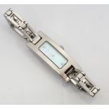 LADIES GUCCI WRISTWATCH the rectangular mother of pearl dial set with two diamonds,