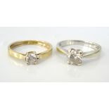 TWO CZ SOLITAIRE RINGS one in nine carat white gold,