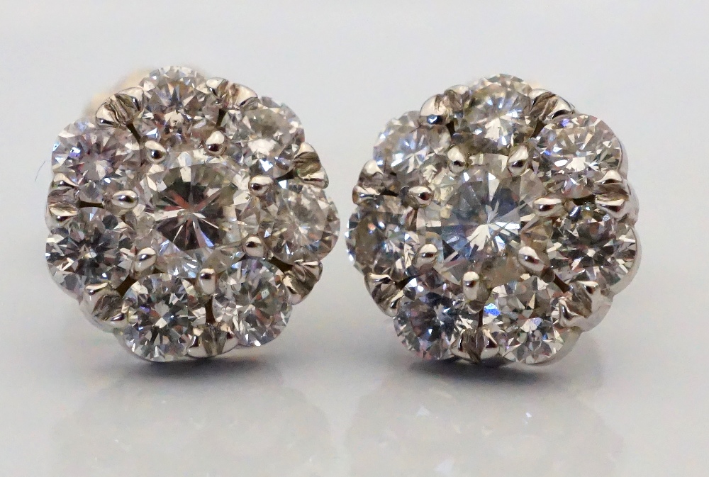 PAIR OF DIAMOND CLUSTER STUD EARRINGS the diamonds on each earring totalling approximately 0.