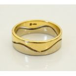 TWO TONE FOURTEEN CARAT GOLD WEDDING BAND with wave detail, marked 14KP,