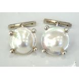 PAIR OF MOTHER OF PEARL AND SILVER CUFFLINKS each with a small blister pearl