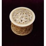 19th CENTURY CHINESE CARVED IVORY CIRCULAR BOX AND COVER profusely decorated overall with figures