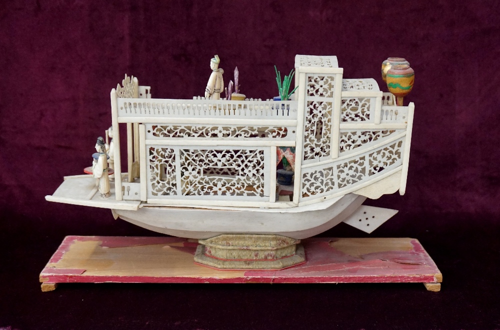 19th CENTURY CHINESE CARVED IVORY PLEASURE BOAT with overall pierced decoration and carved figures,