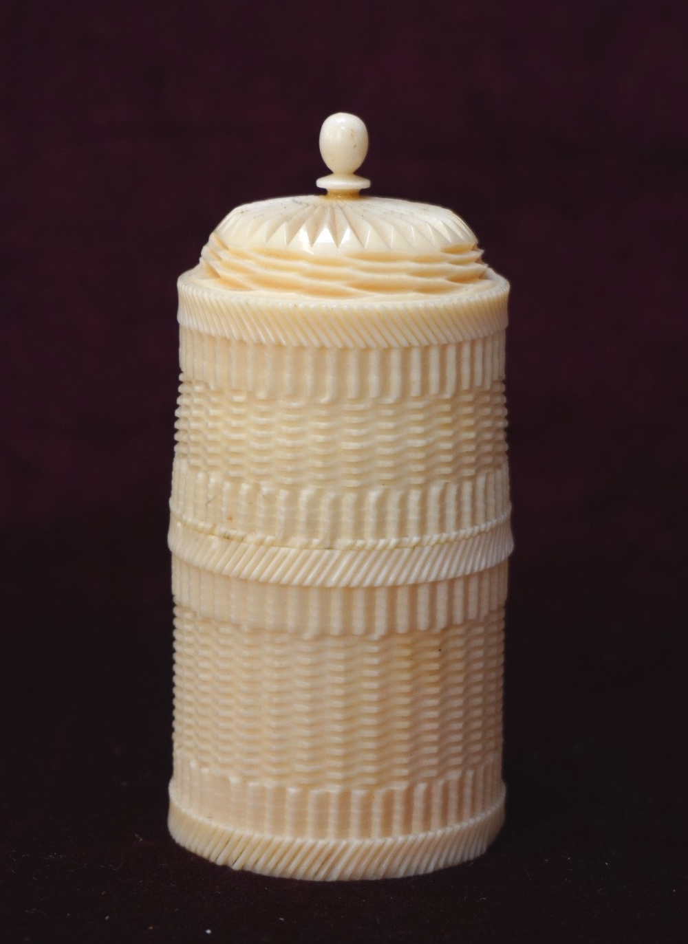 19th CENTURY CONTINENTAL TURNED IVORY CYLINDRICAL BOX the cover with turned finial,