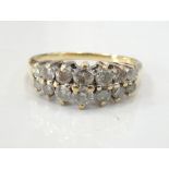 DIAMOND SET DRESS RING on nine carat gold shank,