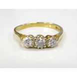 DIAMOND THREE STONE RING on eighteen carat gold shank, the diamonds totalling approximately 0.