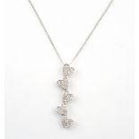 DIAMOND HEART PENDANT the pave diamonds set to multiple heart shaped links,