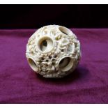 19th CENTURY CHINESE CARVED IVORY PUZZLE BALL with numerous concentric carved balls,