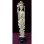 LATE 19th CENTURY CHINESE CARVED IVORY FIGURE OF A NOBLE WOMAN in traditional flowing robes,