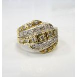 CLEAR GEM SET DRESS RING the gemstones in multiple wavy bands, in fourteen carat gold,