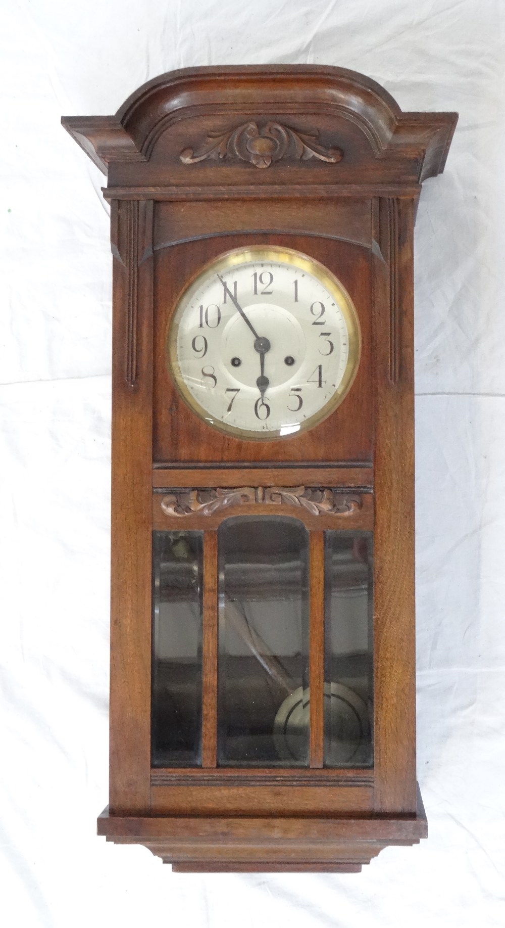 EDWARDIAN MAHOGANY CASED WALL CLOCK the case with raised carved detail,