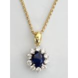 IMPRESSIVE SAPPHIRE AND DIAMOND CLUSTER PENDANT the central oval cut sapphire approximately 3cts in