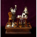 19th CENTURY GERMAN CARVED IVORY AND STAINED WOOD FIGURE GROUP depicting musicians in a tavern,