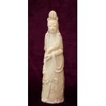 19th CENTURY CHINESE CARVED IVORY FIGURE OF GUAN YIN holding a ruyi in one hand and a basket of