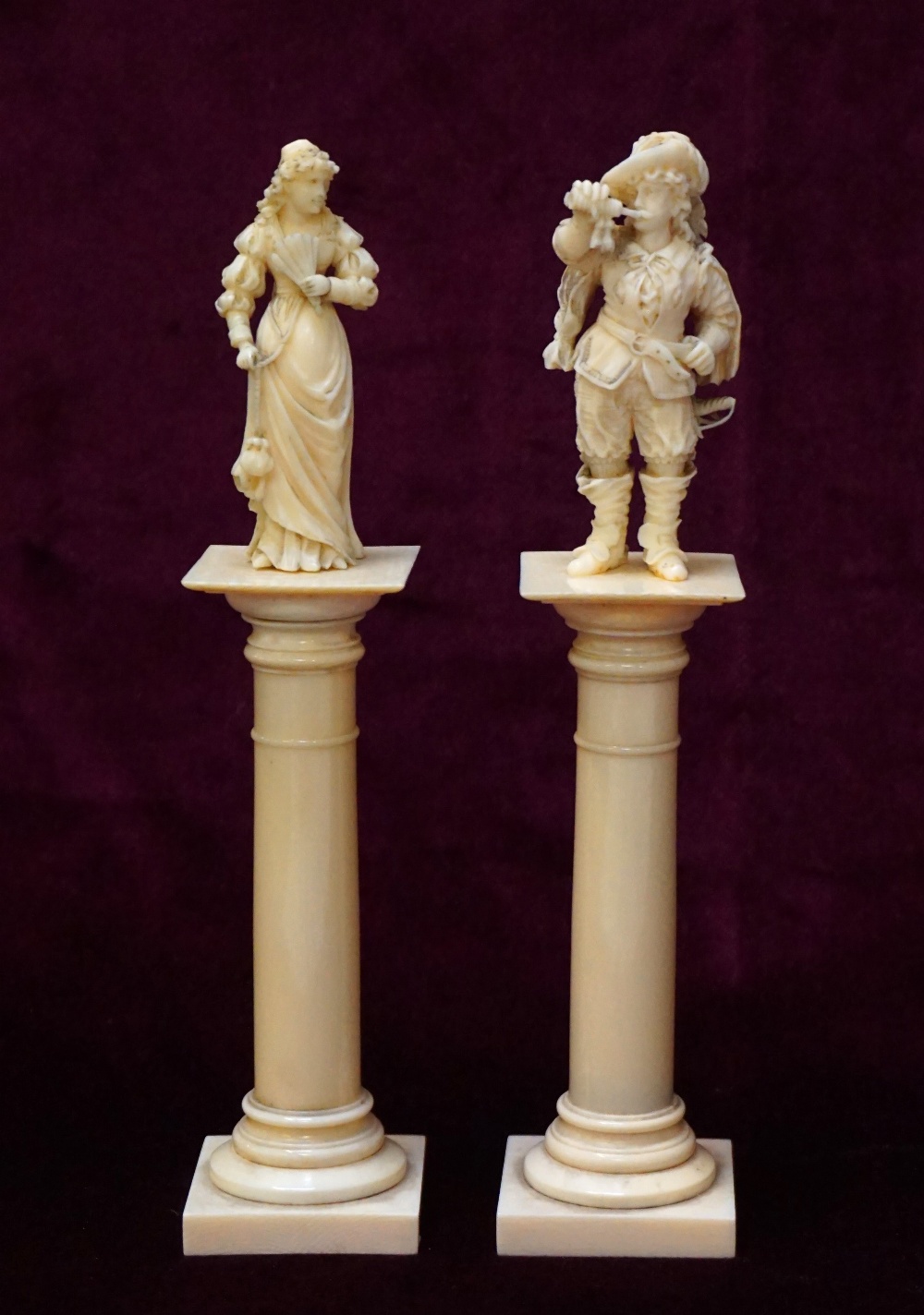 PAIR OF 19th CENTURY CONTINENTAL CARVED IVORY FIGURES depicting a lady and gentleman in 17th