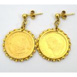 PAIR OF 1/10 KRUGERRAND GOLD DROP EARRINGS dated 1980 and 1982, in nine carat gold mounts,