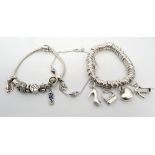 THREE SILVER DESIGNER BRACELETS comprising a Links of London Sweetie bracelet with four charms