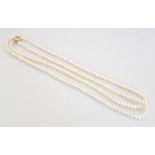 DOUBLE STRAND PEARL NECKLACE with nine carat gold clasp,