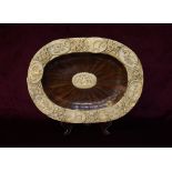 17th CENTURY CONTINENTAL CARVED IVORY AND ROSEWOOD OVAL TRAY the outer rim with eight oval