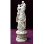 19th CENTURY JAPANESE CARVED IVORY OKIMONO depicting a wise man in elaborate robes and holding a