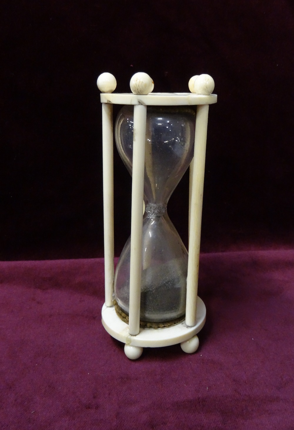 EARLY 19th CENTURY CONTINENTAL IVORY MOUNTED HOUR GLASS TIMER the shaped glass body encased by five