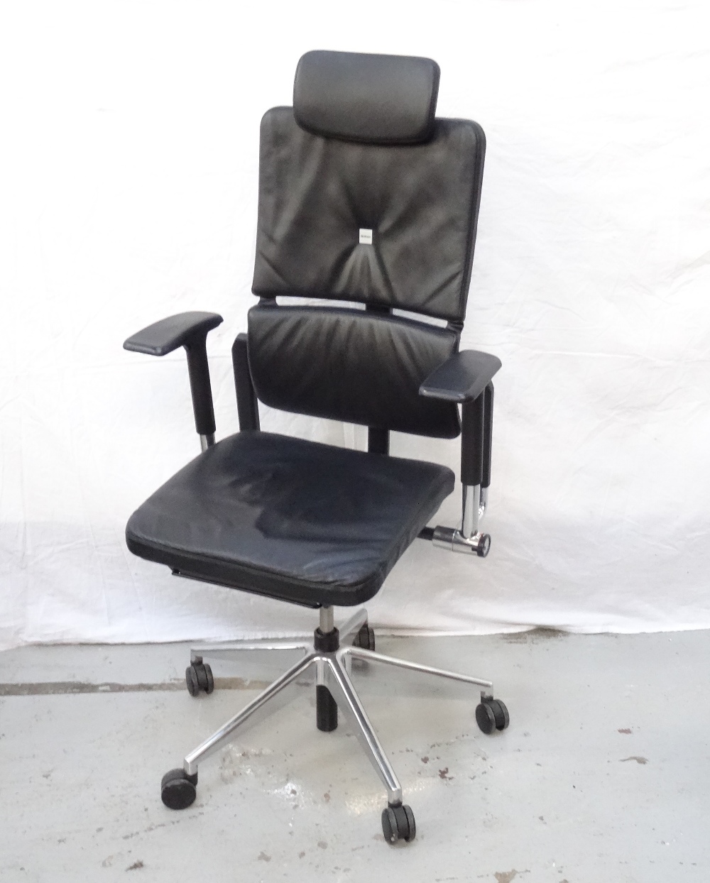 STEELCASE LEATHER EXECUTIVE OFFICE ARMCHAIR with a padded adjustable tilt back and seat,