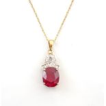 RUBY AND DIAMOND DROP PENDANT the oval cut ruby approximately 4cts below diamonds in shaped