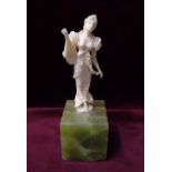 LATE 19th CENTURY CONTINENTAL CARVED IVORY FIGURE OF A WOMAN holding a lyre and dressed in