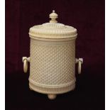 EARLY 19th CENTURY CONTINENTAL CARVED IVORY CYLINDRICAL BOX with turned finial decoration to cover,