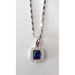 PRETTY SAPPHIRE AND DIAMOND CLUSTER PENDANT the central oval cut sapphire in diamond surround,