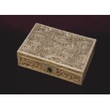 19th CENTURY CHINESE CARVED IVORY RECTANGULAR BOX AND COVER decorated overall with figures in a