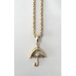 DIAMOND SET NINE CARAT GOLD UMBRELLA PENDANT on nine carat gold chain