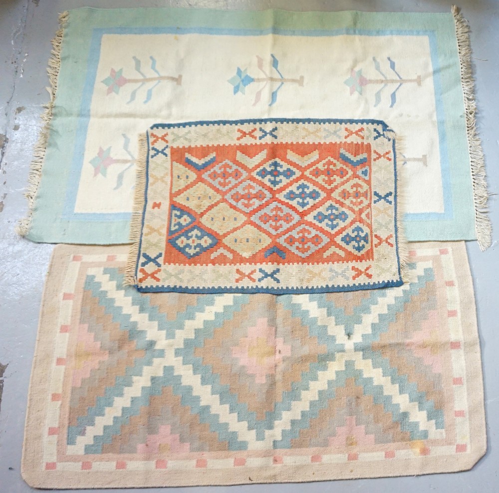 KELIM RUG with a pale ground and geometric pattern, 135cm x 77.