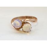 UNUSUAL OPAL TWO STONE TWIST DESIGN RING on nine carat gold shank with Chester hallmark for 1915,