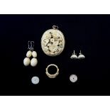 EDWARDIAN CARVED IVORY PENDANT with flowers and leaves,