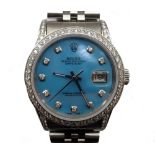 GENTLEMAN'S ROLEX OYSTER PERPETUAL DATE JUST WRISTWATCH with a diamond set bezel and shoulders